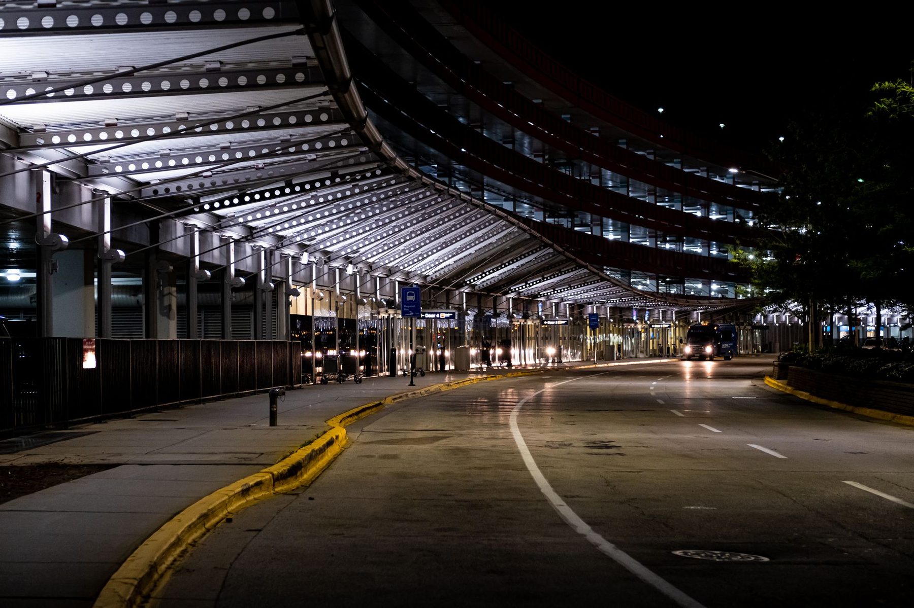 Airport terminal roadway lit at night